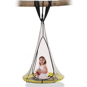 A little girl sitting on a saucer round swing hanging from a tree branch